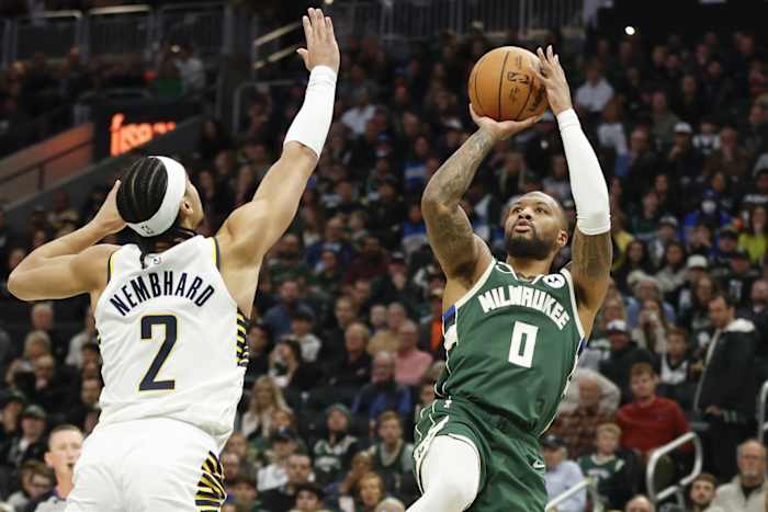 Milwaukee Bucks guard Damian Lillard (0) shoots against Indiana Pacers guard Andrew Nembhard (2)